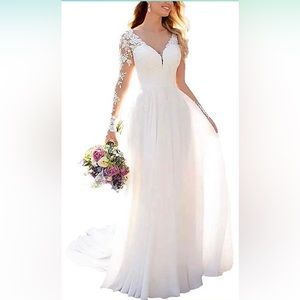 Wedding dress, never worn and no alterations done!